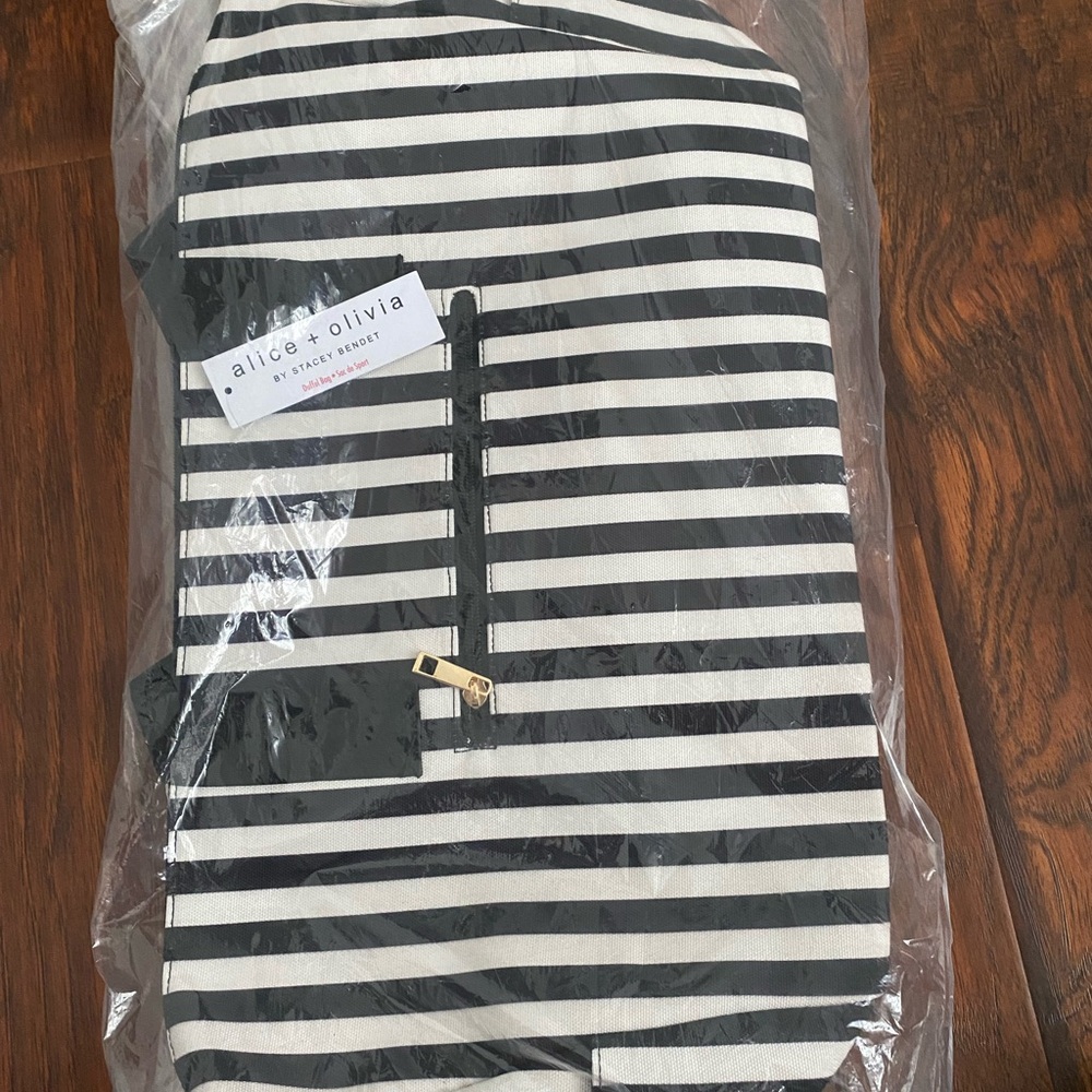 Black and White Striped Duffle Bag. New with tags, not opened